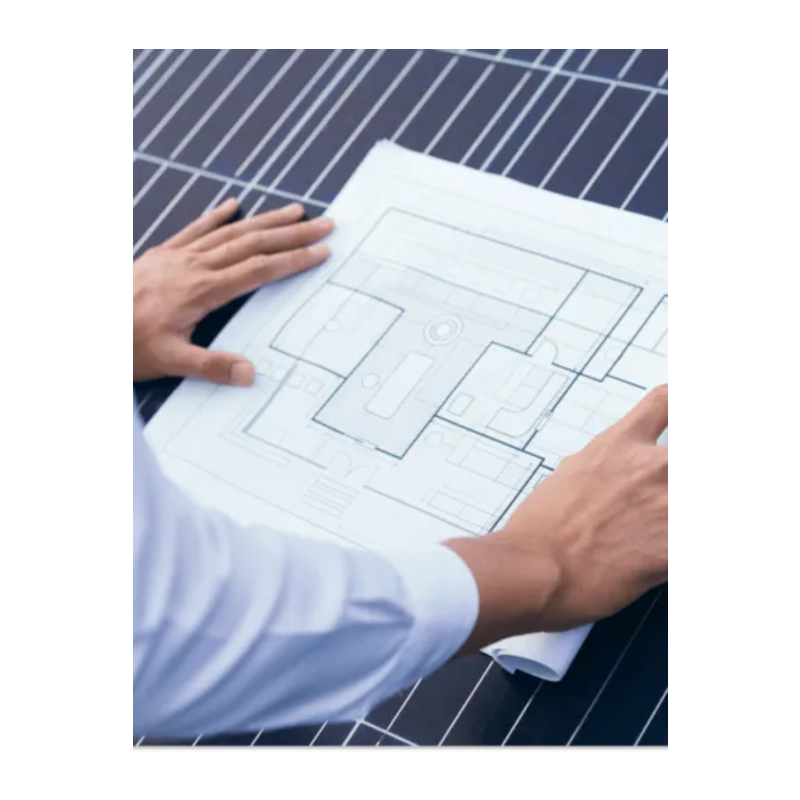 Engineer reviewing blueprints 