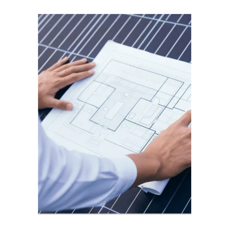 Engineer reviewing blueprints 